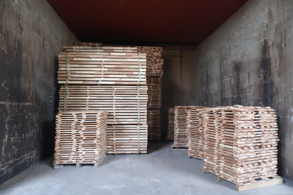Stickered timber loads inside a drying kiln chamber