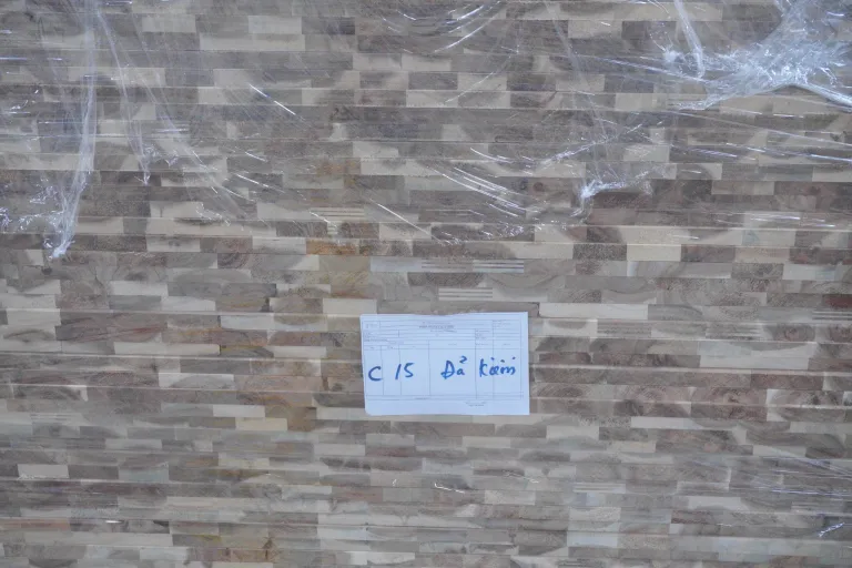 Wrapped stack of acacia panels with a paper label